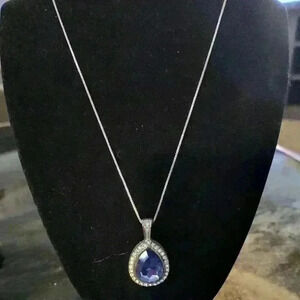 R M N sliver tone with blue and white rhinestone pendant